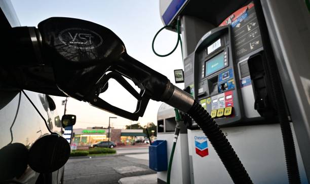 gettyimages-1243758228-612x612 A nozzle pumps gasoline into a vehicle at a gas station in Los Angeles, California on October 5, 2022. - Saudi Arabia, Russia and other top oil producers agreed on a major cut in production on Wednesday to boost crude prices -- a move denounced by the United States as a concession to Moscow that will further hurt the global economy. US gas prices have already been trending higher in recent weeks and California gas prices are approaching record highs again. (Photo by Frederic J. BROWN / AFP) (Photo by FREDERIC J. BROWN/AFP via Getty Images)